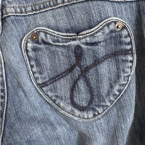 The Kate By Juicy Couture Heart Shaped Pocket. Fits more like size 27